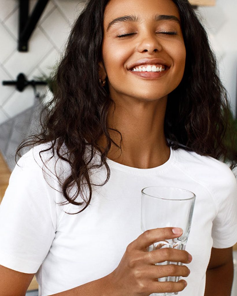 pretty-afro-girl-holds-glass-water-has-happy-look